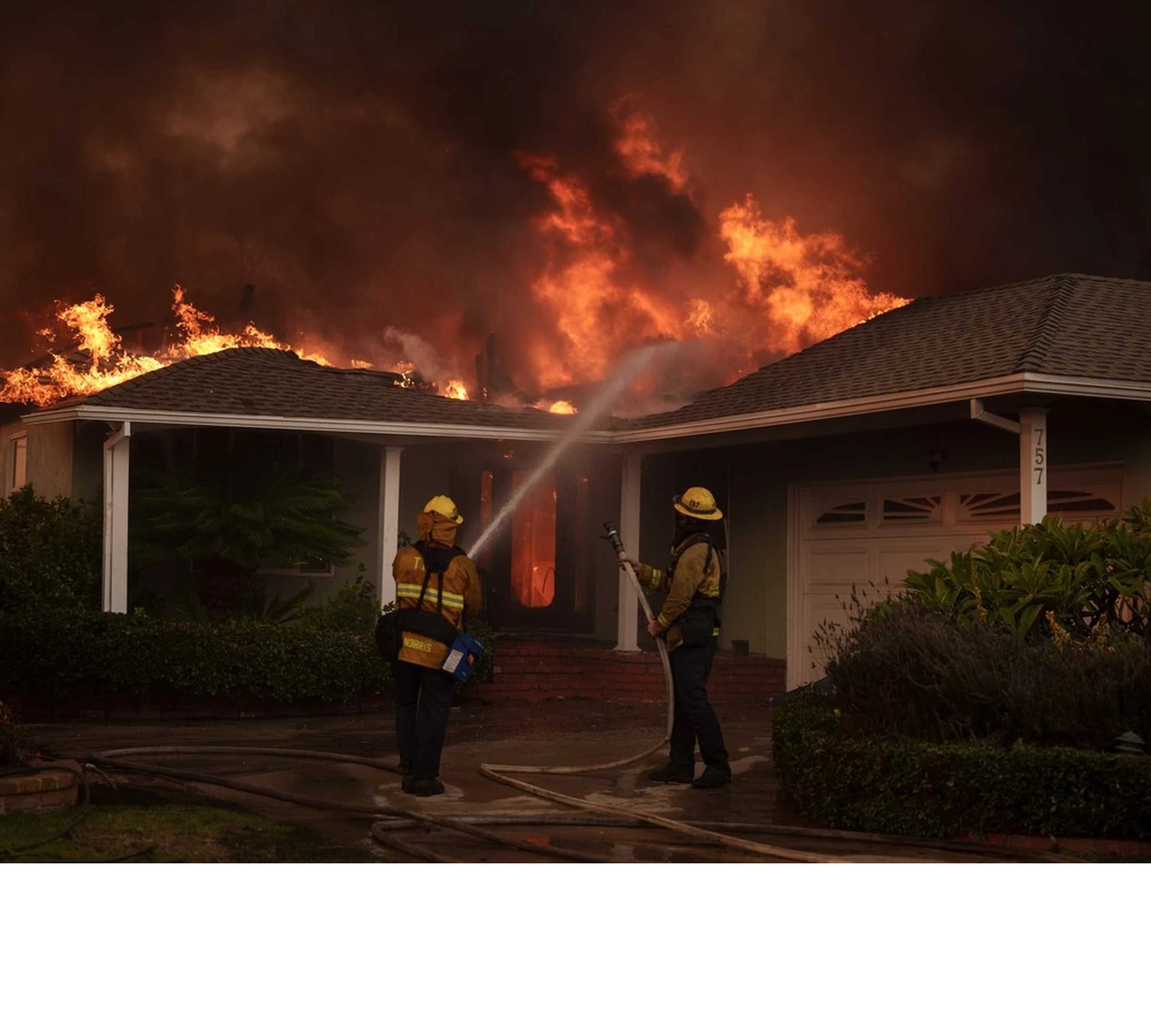 Wildfire in Los Angeles burns down a house